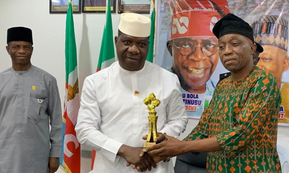 Opeyemi Bamidele receiving award from Progress FM, GM