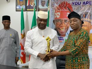 Opeyemi Bamidele receiving award from Progress FM, GM